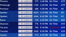 A departure board at the Philadelphia International Airport shows that US Airways Flight 796 to Tel Aviv has been canceled, Tuesday, July 22, 2014, in Philadelphia. The Federal Aviation Administration is telling U.S. airlines they are prohibited from flying to the Tel Aviv airport in Israel for 24 hours after a Hamas rocket exploded nearby. (AP Photo/Matt Rourke)