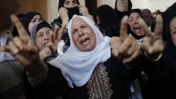Palestinian female mourners grieve during the funeral of Mohammed al-Hamaida after he was killed in an Israeli air strike, on July 22, 2014.