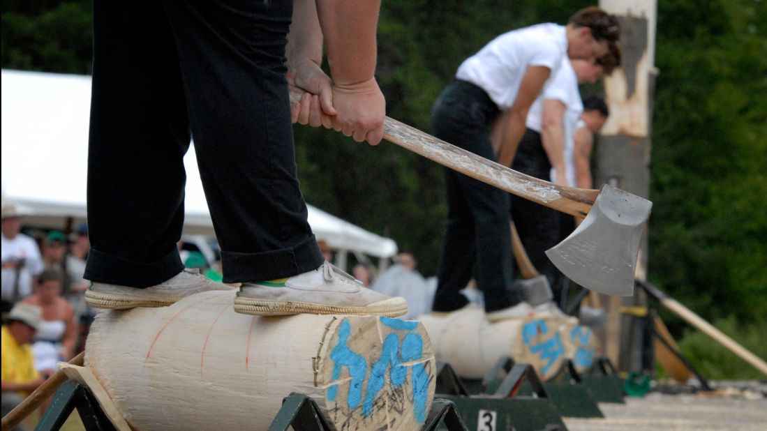 Before the existence of chainsaws, axes were used to cut felled trees into logs. In the underhand chop event, the competitor stands on top of a horizontally supported log driving ax blows straight down between their legs.