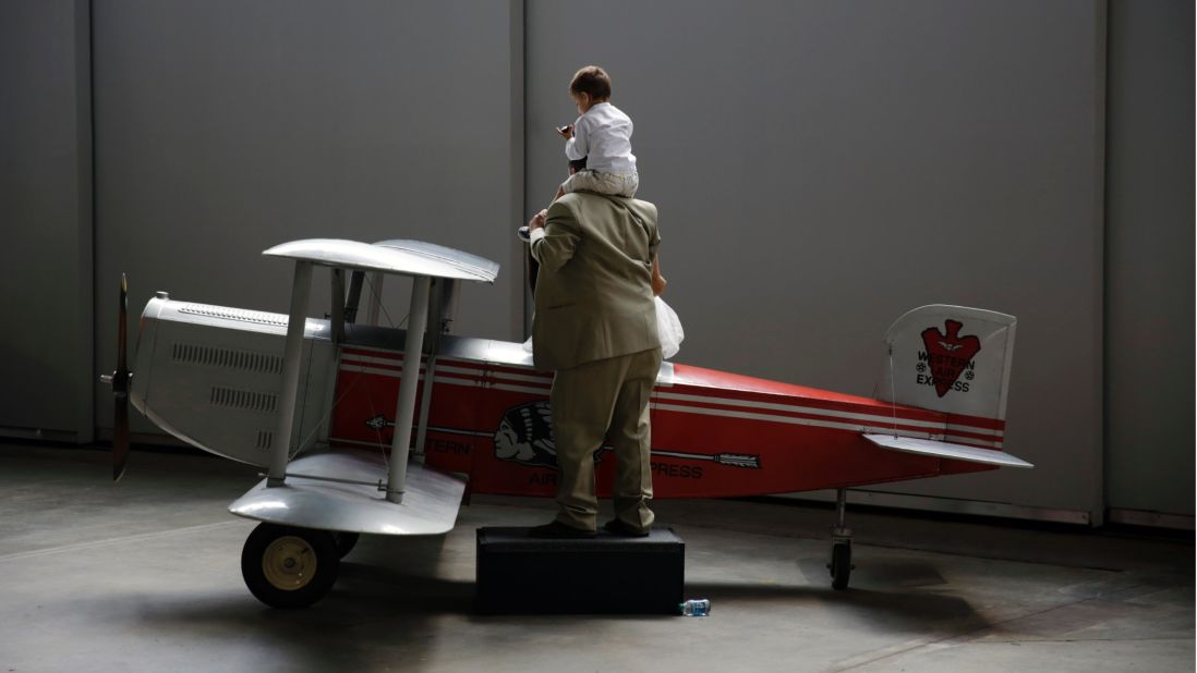 Andy Pharo, 2, and his father, Mark Pharo, enjoy the museum's Western Air Express Douglas M-2 model airplane.