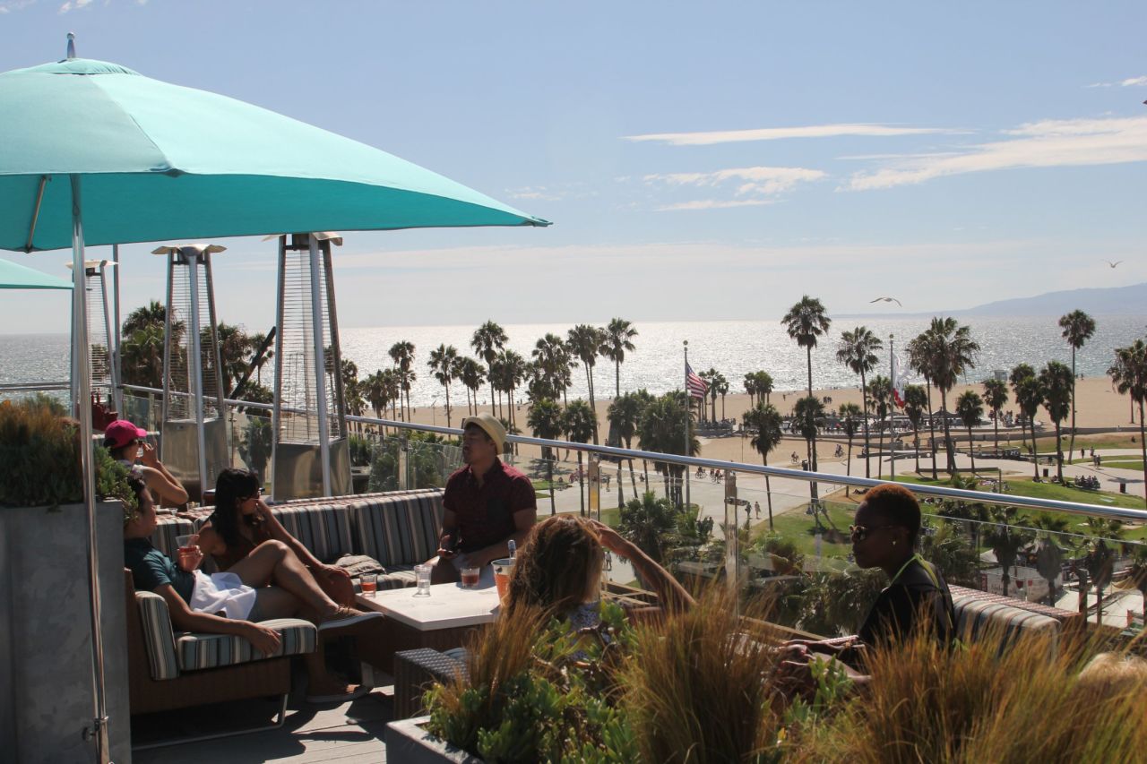 The 360-degree view from the High Rooftop Lounge at Hotel Erwin in Los Angeles commands everything from the storied beachside basketball courts of Venice Beach just below the bar to the storyboard hills of Hollywood behind it.