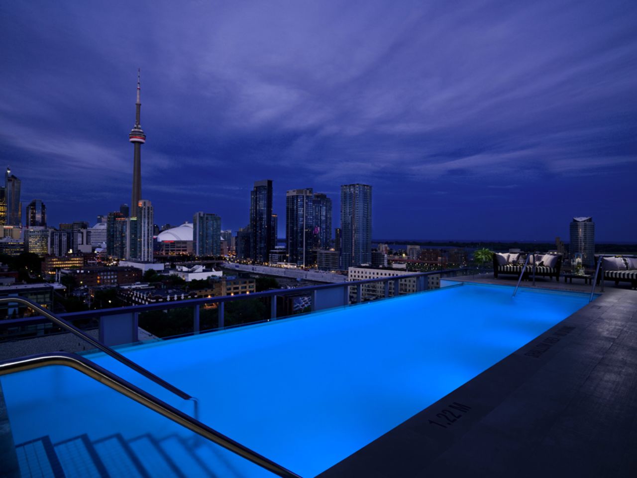 The terrace that wraps all the way around the Rooftop Lounge at the Thompson Toronto Hotel offers views of Lake Ontario that whip you away from the city-feel in an instant.