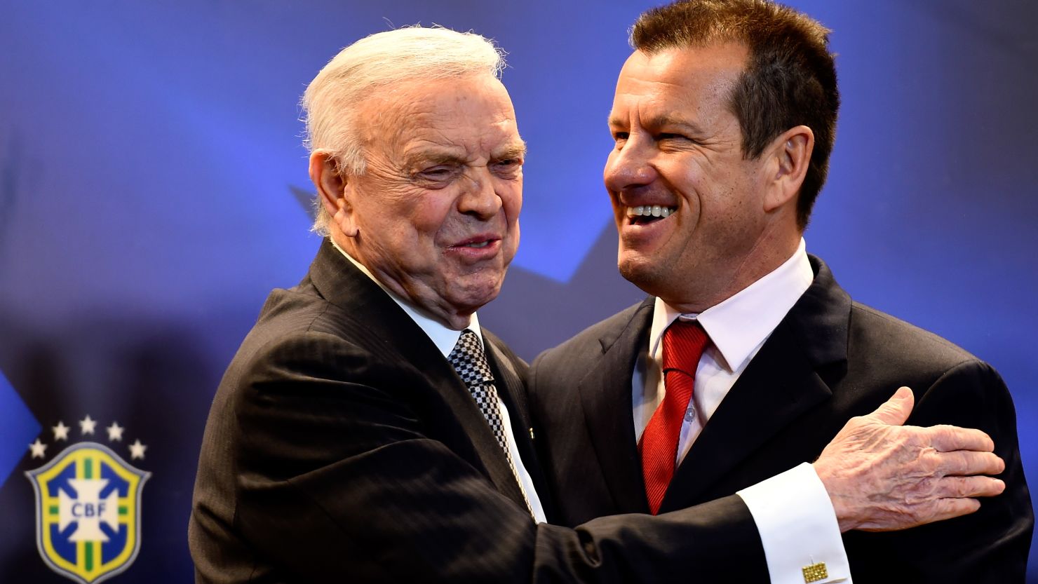 Brazil's new coach Dunga (R) with the country's football federation president Jose Maria Marin.