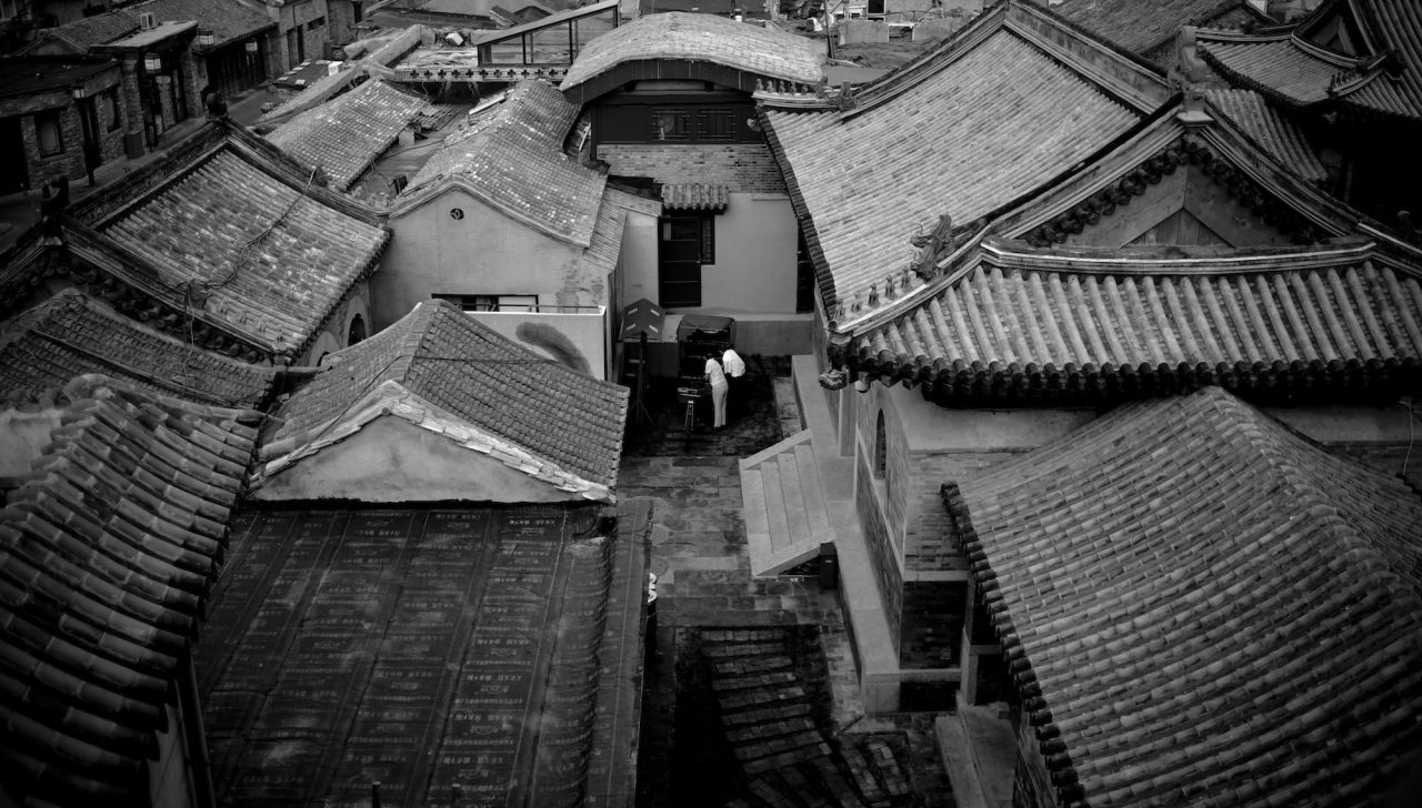 More traditional Chinese scenes are hidden in alleyways. Those worn footpaths into lanes and hutongs are public spaces, which hold some of the most captivating views in China's big cities.