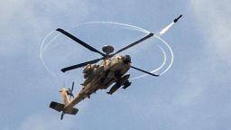 An Israeli Apache attack helicopter shoots a missile over the Gaza Strip on July 19, 2014.