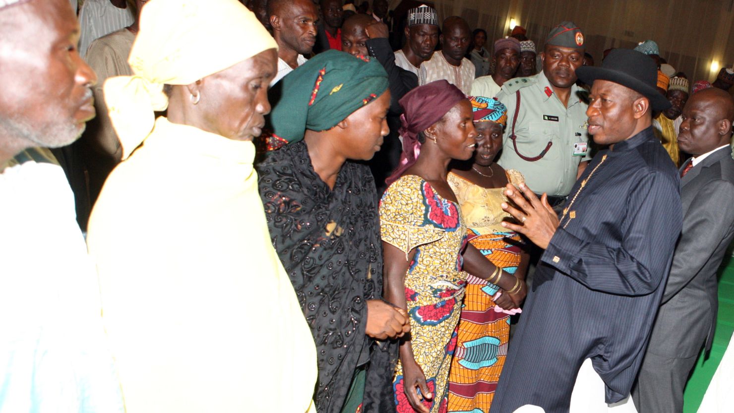 President Jonathan meets Chibok schoolgirls who escaped Islamist captors, and relatives of the hostages, in Abuja on July 22.