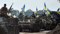 Ukrainian servicemen sitting atop armored personnel carriers (APC) travel near the eastern Ukrainian city of Slavyansk on July 11, 2014. Ukraine's military on Friday reported losing 23 servicemen in clashes across the separatist east that threatened to shatter slim Western hopes of a truce in Europe's deadliest conflict in decades. AFP PHOTO/GENYA SAVILOV (Photo credit should read GENYA SAVILOV/AFP/Getty Images)