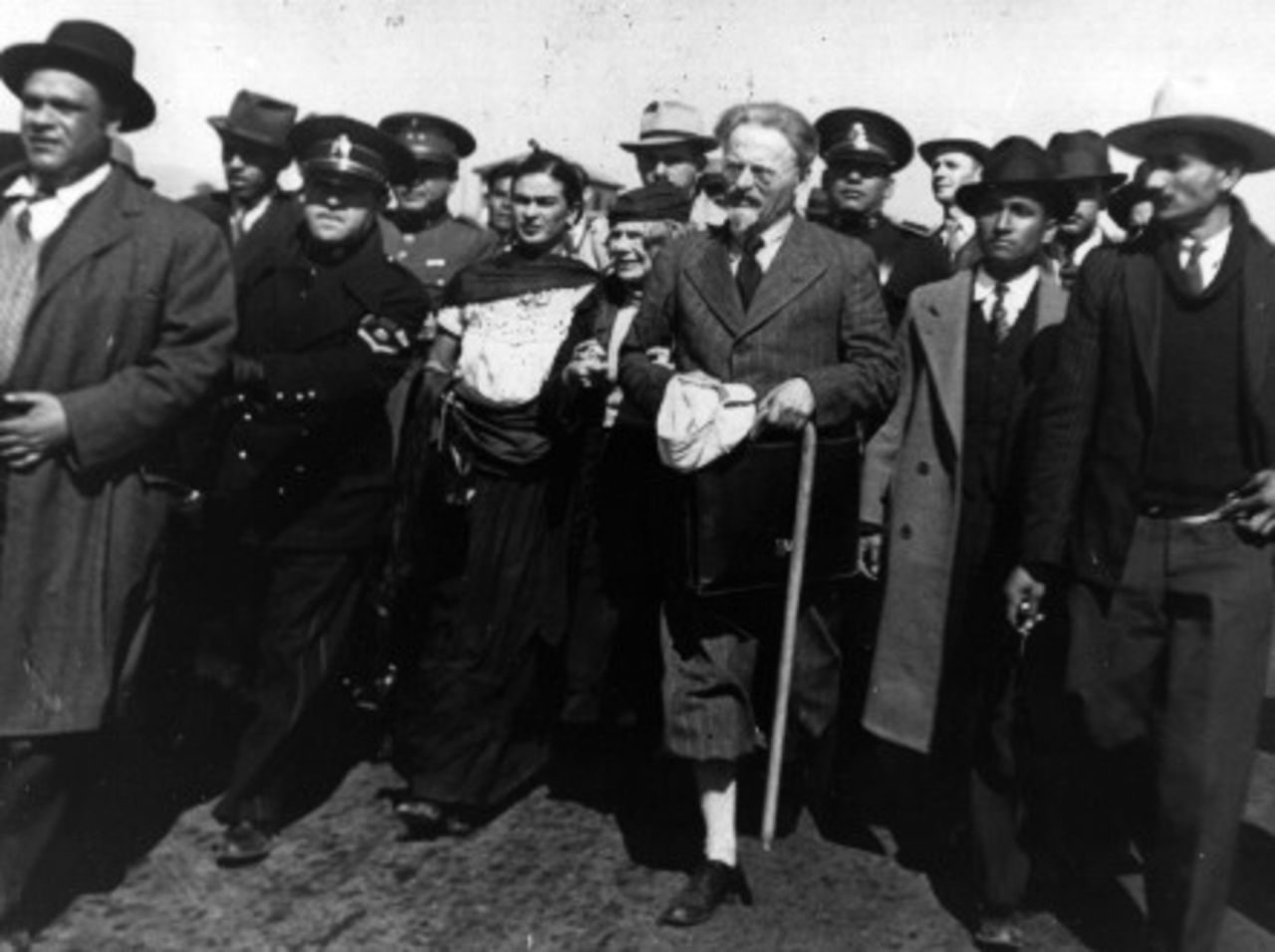 Trotsky and his wife arrive in Mexico in 1937, surrounded by police, and Kahlo. - (Getty Images)