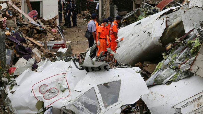Rescue workers survey the wreckage on July 24. 