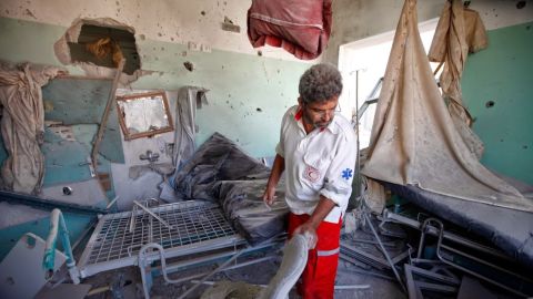 A worker cleans up at Shuhada al-Aqsa Hospital in Gaza after it was shelled on July 21.