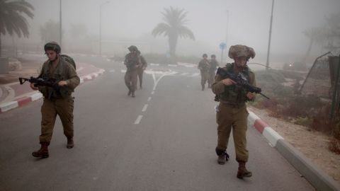 Israeli soldiers patrol the Israel-Gaza border on July 24.