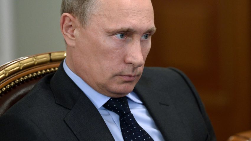 Russia's President Vladimir Putin attends a meeting in his Novo-Ogaryovo residence outside Moscow, on July 24, 2014. 