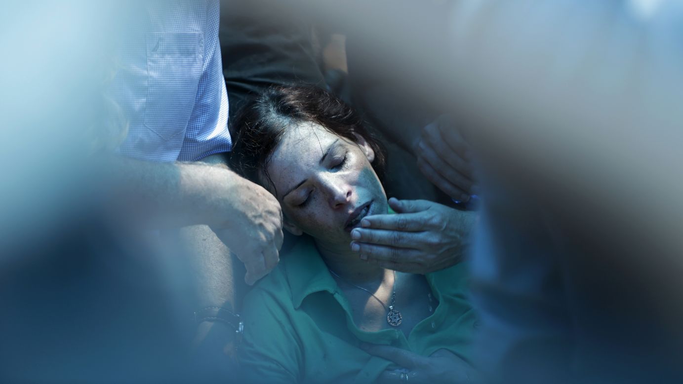 Dana, the sister of Israeli soldier Tsafrir Bar-Or, mourns during his funeral in Holon, Israel, on Monday, July 21.