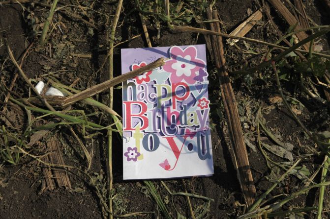 A birthday card found in a sunflower field near the crash site of <a href="index.php?page=&url=http%3A%2F%2Fwww.cnn.com%2Fspecials%2Fworld%2Fmh17-specials-page%2Findex.html" target="_blank">Malaysia Airlines Flight 17</a> in eastern Ukraine, on Thursday, July 24. The passenger plane was shot down July 17 above Ukraine. All 298 people aboard were killed, and much of what they left behind was scattered in a vast field of debris.