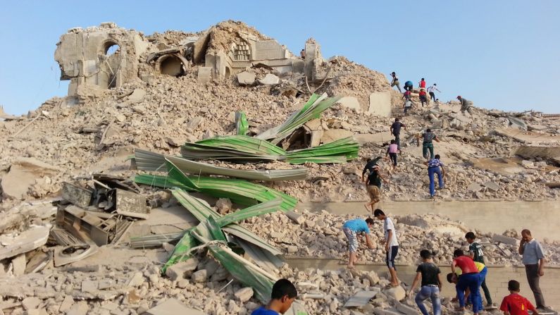 Iraqis inspect the wreckage of the grave of the prophet Jonah in Mosul. Even if the story of Jonah is more myth than fact, it remains an important symbol for Christians.