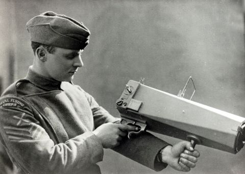British war photographer David McLellan, originator of the photographic section of the Royal Flying Corps, holds a camera specially adapted for aerial pictures in 1915. The potential of aerial surveillance and bombardment was most rigorously tested and developed in the British campaign against the Ottoman Empire during WWI. 