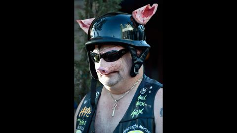 A man dresses as a biker pig on July 24.
