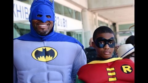 Erien and Adonis Hodge dress as Batman and Robin on July 24.