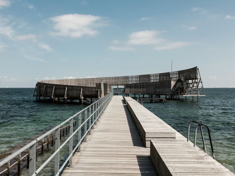 Kastrup Pier in Denmark has a structure at the end that encircles an outdoor swimming area.