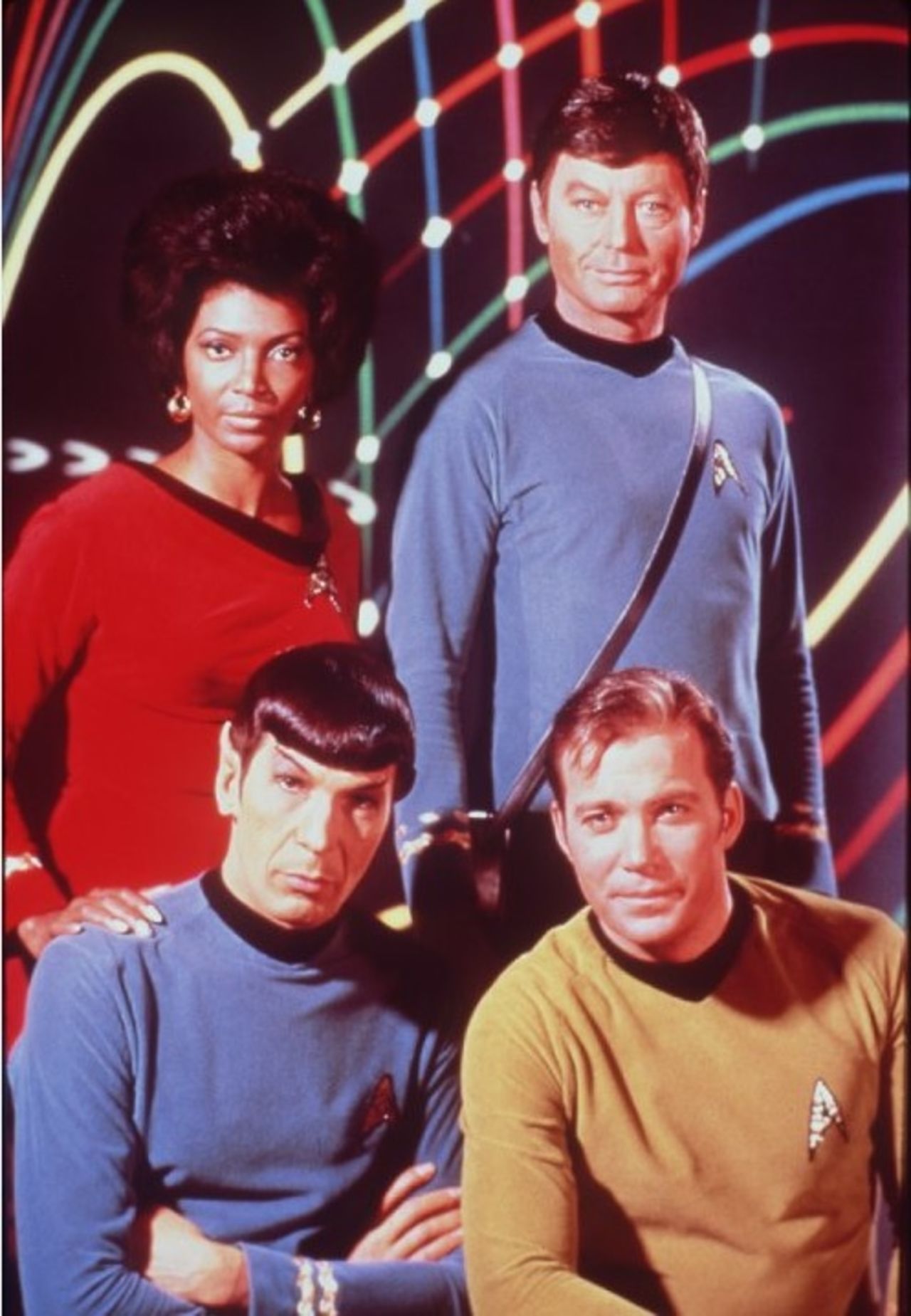Leonard Nimoy, William Shatner, DeForest Kelley and Nichelle Nichols, from the original Star Trek series. Dr. McCoy, top right, is carrying that show's version of the Tricorder.
