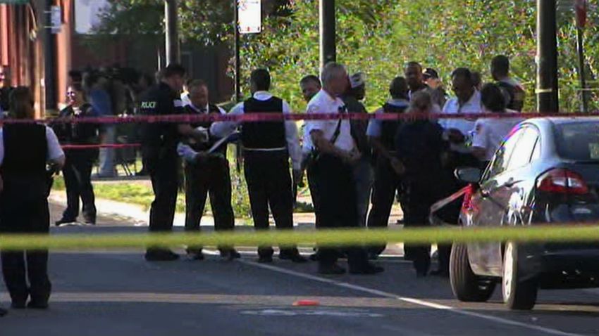 Police investigate the scene of a deadly shooting Friday afternoon in Chicago.