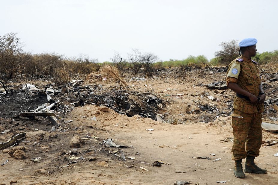 A United Nations soldier stands at the crash site of Air Algerie Flight 5017 on Saturday, July 26. A U.N. spokeswoman says a second flight data from the DC-83 was recovered on Saturday. The flight, carrying 116 people when it took off from Burkina Faso on July 24 bound for Algiers, crashed in Mali's Gossi region, west of Gao. "Regrettably, there were no survivors," said French President Francois Hollande.