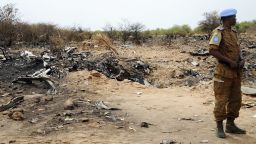 A U.N. soldier stands at the crash site of the Air Algerie Flight AH 5017 in Mali's Gossi region, west of Gao, on Saturday, July 26. A U.N. spokeswoman says that the seconf flight data recorder was recovered on Saturday.