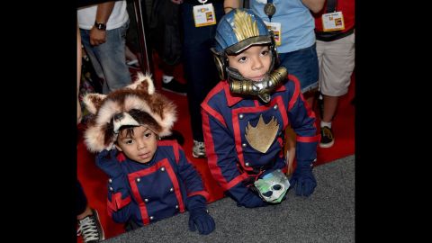Two young fans dressed as Rocket Raccoon and Star-Lord from Marvel's "Guardians of the Galaxy" attend the convention.