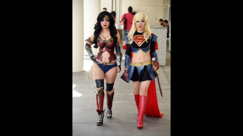 Two attendees cosplay Wonder Woman and Supergirl on July 26. Cosplayers wear costumes of their favorite characters.