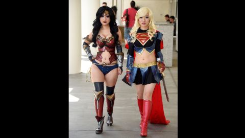 Two attendees cosplay Wonder Woman and Supergirl on July 26. Cosplayers wear costumes of their favorite characters.