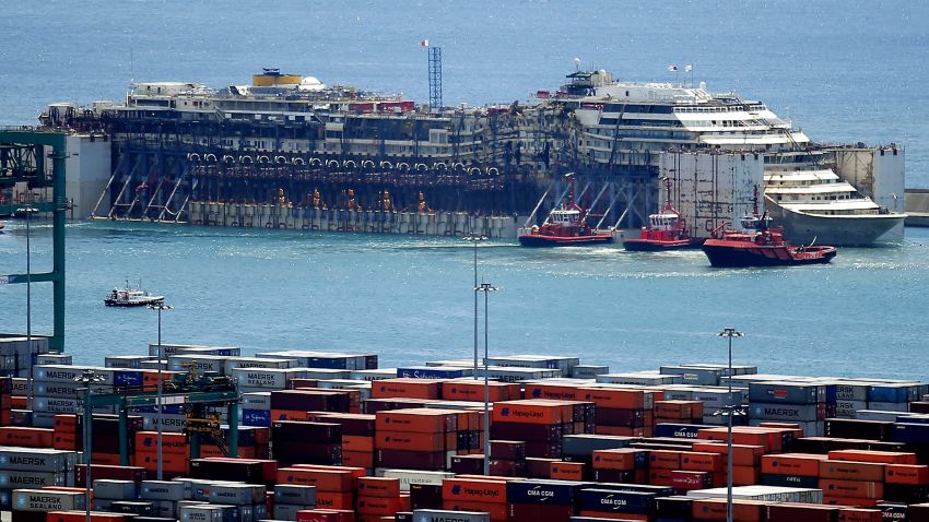 The refloated wreck of the Costa Concordia is towed to the Italian port of Genoa on July 27, ending the ship's final journey to be scrapped two and a half years after it capsized at a cost of 32 lives.