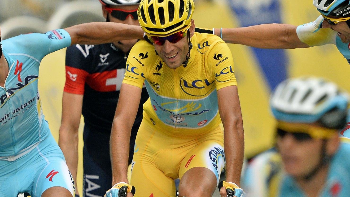 Vincenzo Nibali is congratulated by his Astana teammates after completing his yellow jersey triumph in the 2014 Tour de France