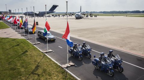 Hearses carrying the coffins with the remains of the victims leave Eindhoven airbase on July 26