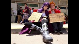Leela and Fry, from the recently canceled Futurama, beg on the sidewalk outside the Comic-Con convention in San Diego on Sunday, July 27. Sunday was the final day of the annual convention, mecca of all things pop culture.