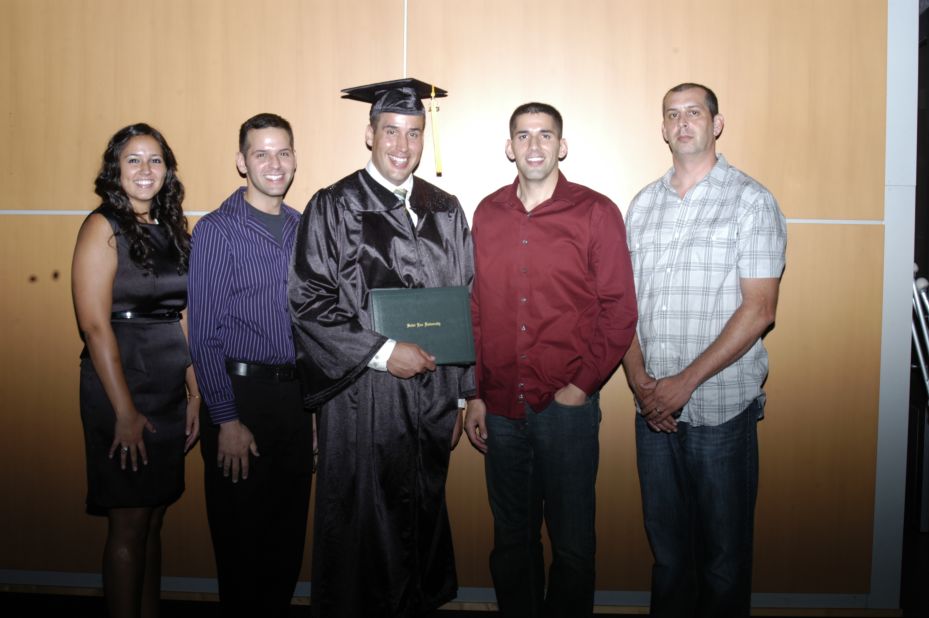 Boukari stands with his family in 2013 after his graduation from Saint Leo University. His older brother Bryan, to his left, was the one to inspire Boukari to lose weight. 
