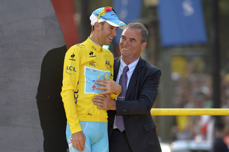 Nibali is congratulated by Hinault on the podium in the Champs-Elysees.
