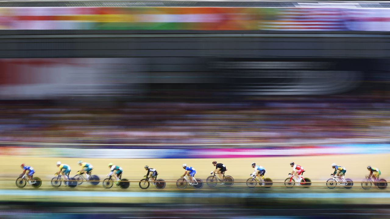 In this photo, which was shot using a slow shutter speed, cyclists compete in a qualifying heat for the men's 40-kilometer points race Saturday, July 26, at the Commonwealth Games in Glasgow, Scotland. New Zealand's Thomas Scully won gold in the event.