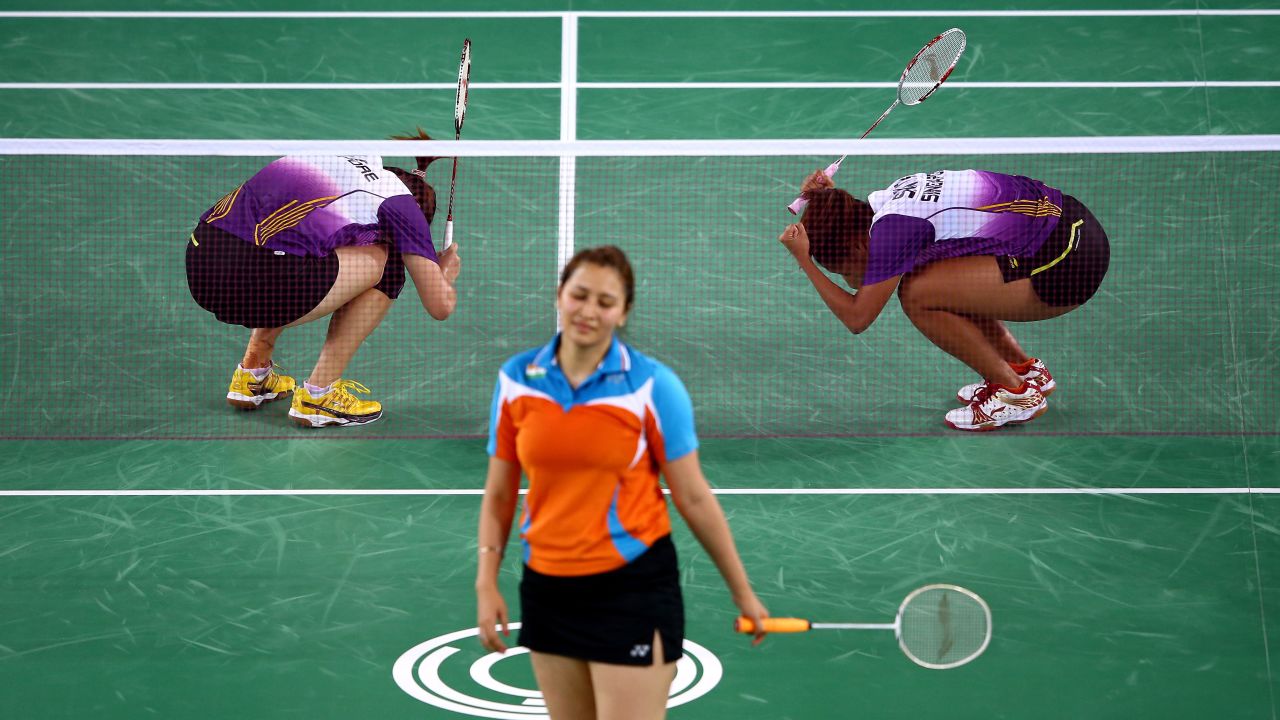 Singapore badminton players Shinta Mulia Sari and Lei Yao, top, celebrate winning the bronze medal after they defeated India's Ashwini Ponnappa and Jwala Gutta at the Commonwealth Games in Glasgow, Scotland, on Monday, July 28.