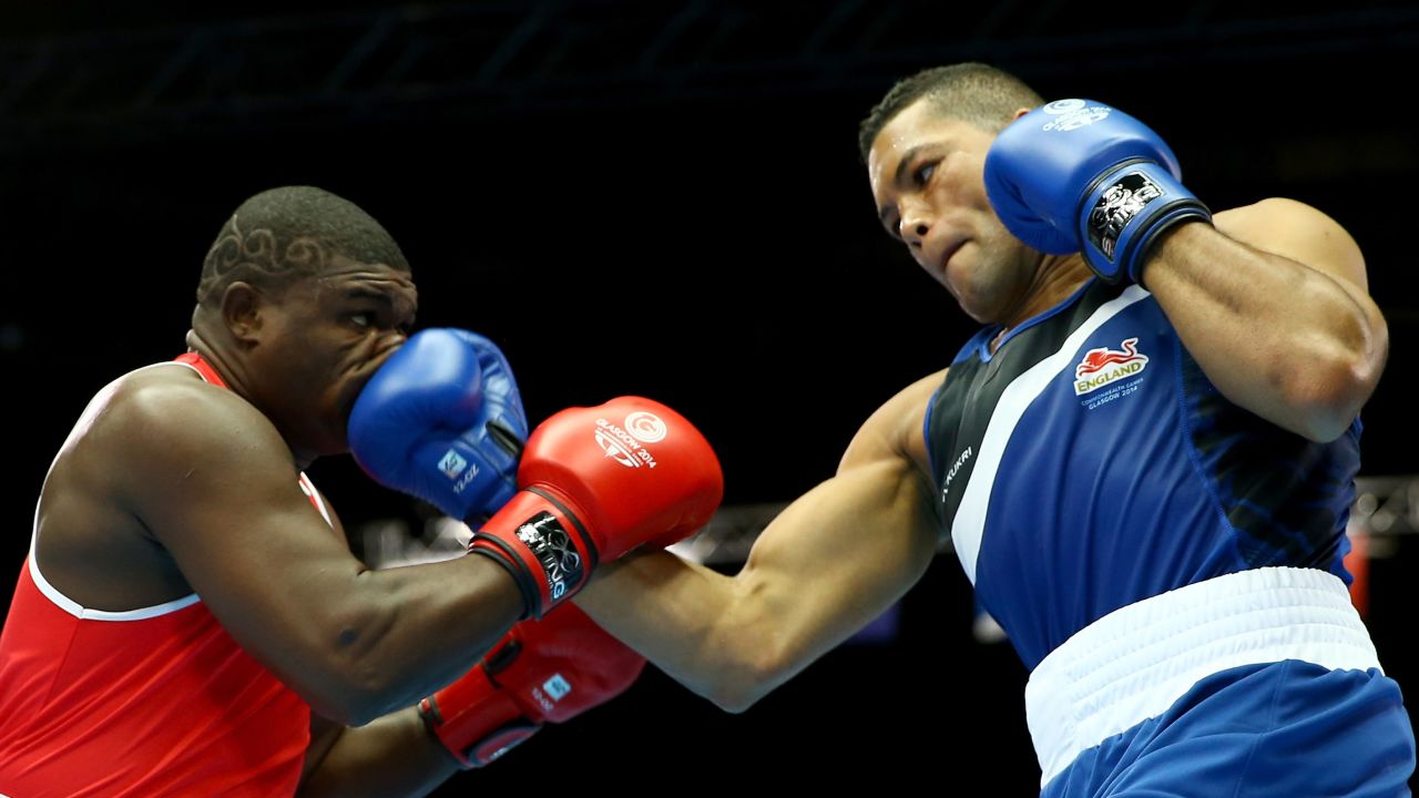 Joseph Joyce of England, right, boxes Keddy Agnes of Seychelles in the super heavyweight preliminaries Friday, July 25, at the Commonwealth Games in Glasgow, Scotland. Joyce won by unanimous decision to advance to the quarterfinals.