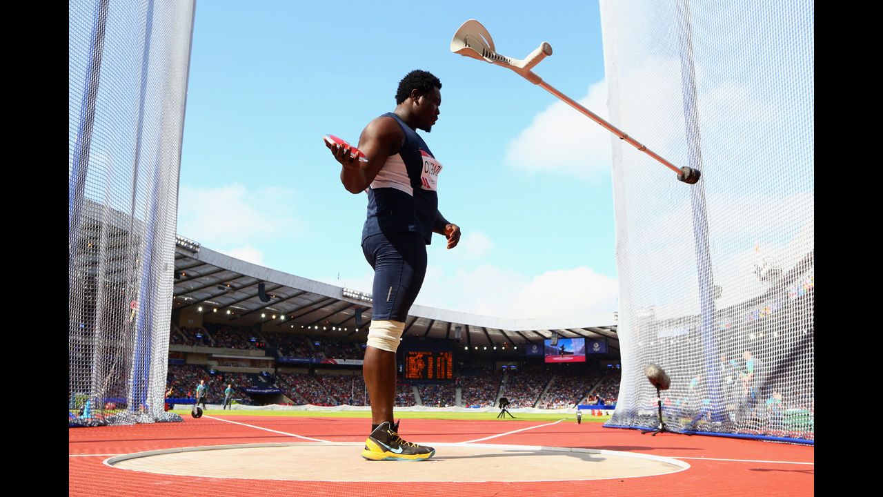 Nigerian Paralympic athlete Richard Okigbazi throws his walking aid away before competing in the men's discus final at the Commonwealth Games in Glasgow, Scotland, on Monday, July 28. Okigbazi, who has only one leg, finished third in the event behind England's Dan Greaves.