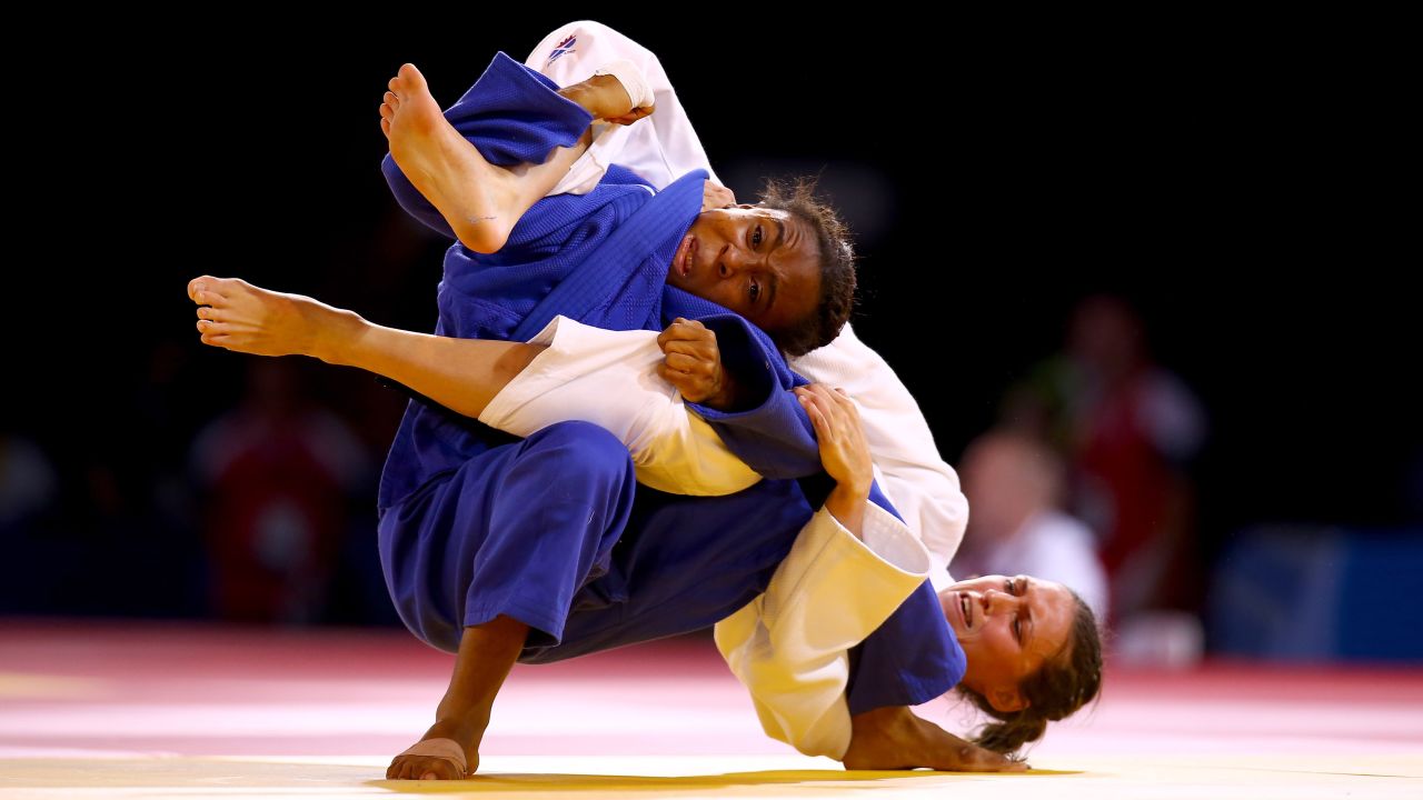 Scotland's Kimberley Renicks, in white, defeats Cameroon's Marcelle Monabang in a judo match Thursday, July 24, at the Commonwealth Games in Glasgow, Scotland. Renicks would go on to win the gold medal in her weight class. 