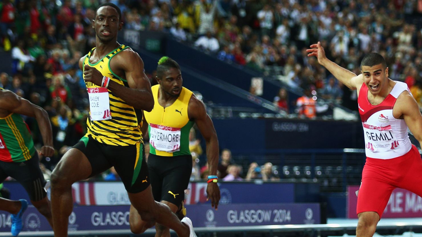 Kemar Bailey-Cole crests the tape ahead of Adam Gemili of England to take the Commonwealth Games 100 title.