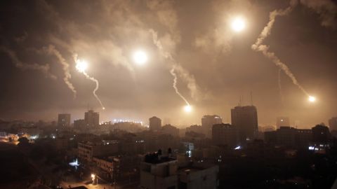 Flares from Israeli forces light up the night sky of Gaza City on July 29.