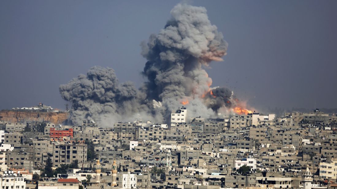Smoke and fire rise above Gaza City after an Israeli airstrike on July 29.