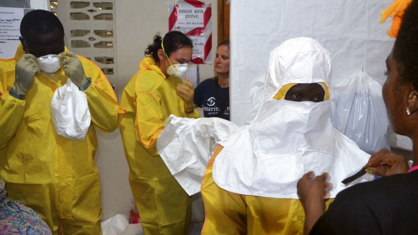 A picture taken on July 24, 2014 shows staff of the Christian charity Samaritan's Purse putting on protective gear in the ELWA hospital in the Liberian capital Monrovia.