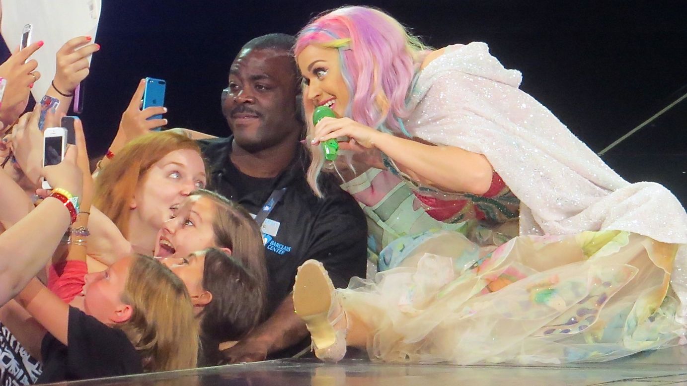 Pop star Katy Perry poses for a fan's selfie while performing at the Barclays Center in New York on Thursday, July 24.