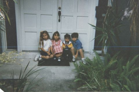 The Naif siblings sit outside the family's home in Tampa. From left to right, Atheer, Athar, Naim (the author) and Nayef.