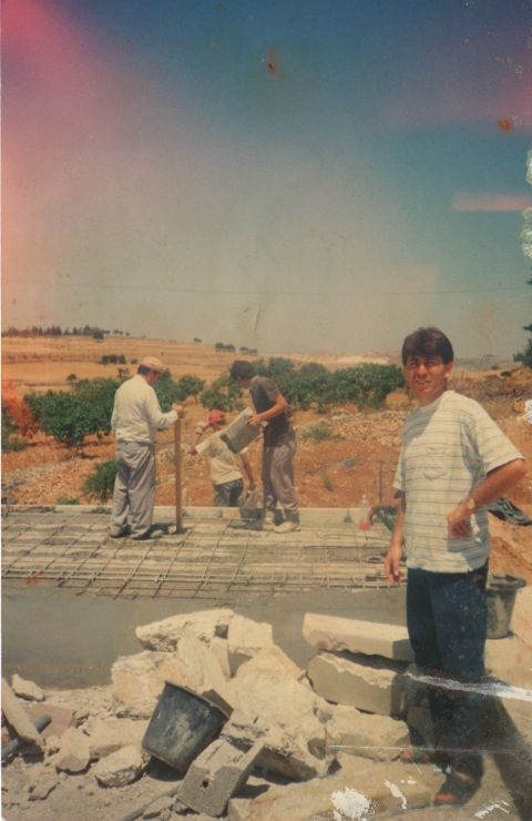 The Naif family works to expand his grandmother's patio in the '90s. When Israel built a new settlement after the second intifada, according to Naim Naif. "My grandmother lost a lot of land."