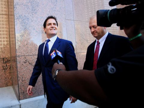 Cuban exits federal court in Dallas on September 30, 2013, during a trial over regulators' claims he engaged in insider trading when he sold his stake in a Canadian Internet search company. The jury acquitted him of the charge, handing a defeat to the government.