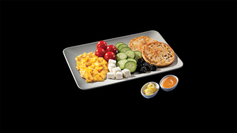 This breakfast plate served at McDonald's Turkey consists of eggs, tomatoes, feta cheese, cucumbers, berries, toast, and honey. You might almost forget you're at a fast food chain.